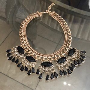 Gold fashion necklace with black teardrops